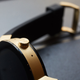 The watch has a single button, and two small microphones.